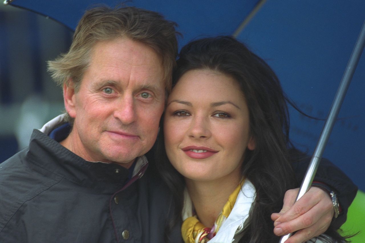 Michael Douglas and Catherine Zeta-Jones at a golf course in St. Andrew's on October 11, 2000. | Source: Getty Images