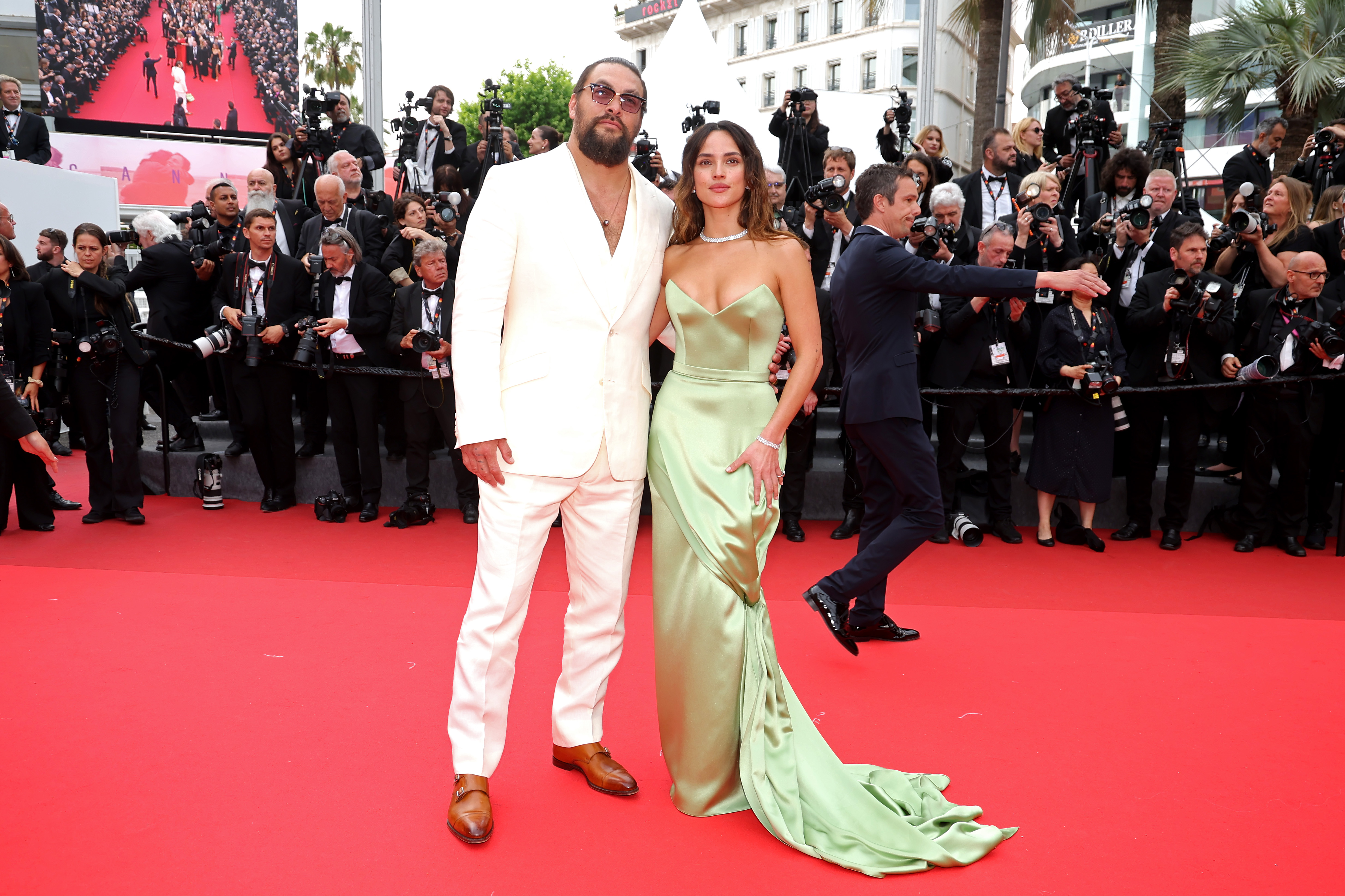Jason Momoa and Adria Arjona attend the "Highest 2 Lowest" red carpet at the 78th annual Cannes Film Festival at Palais des Festivals on May 19, 2025, in Cannes, France. | Source: Getty Images