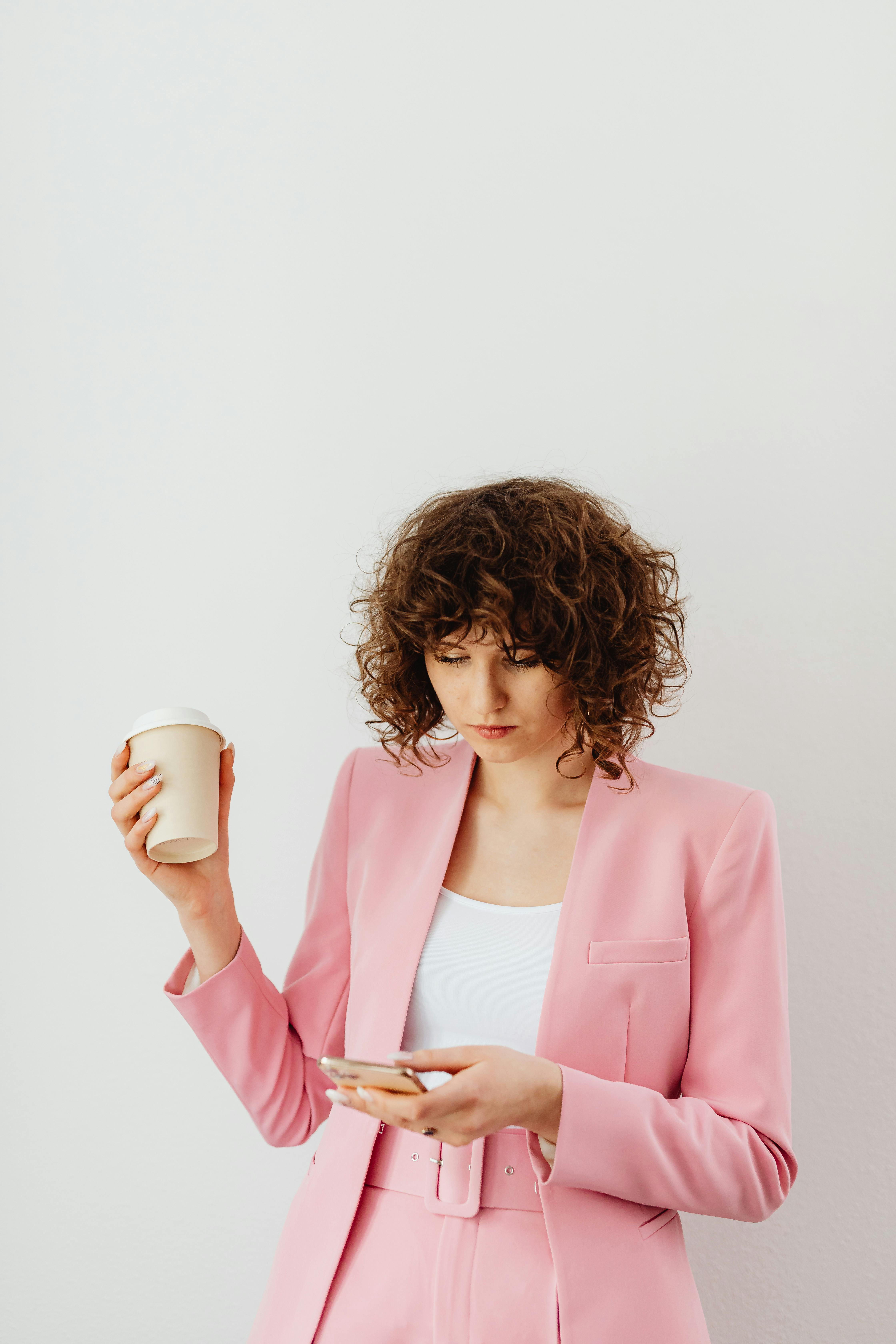 A woman using a smartphone | Source: Pexels
