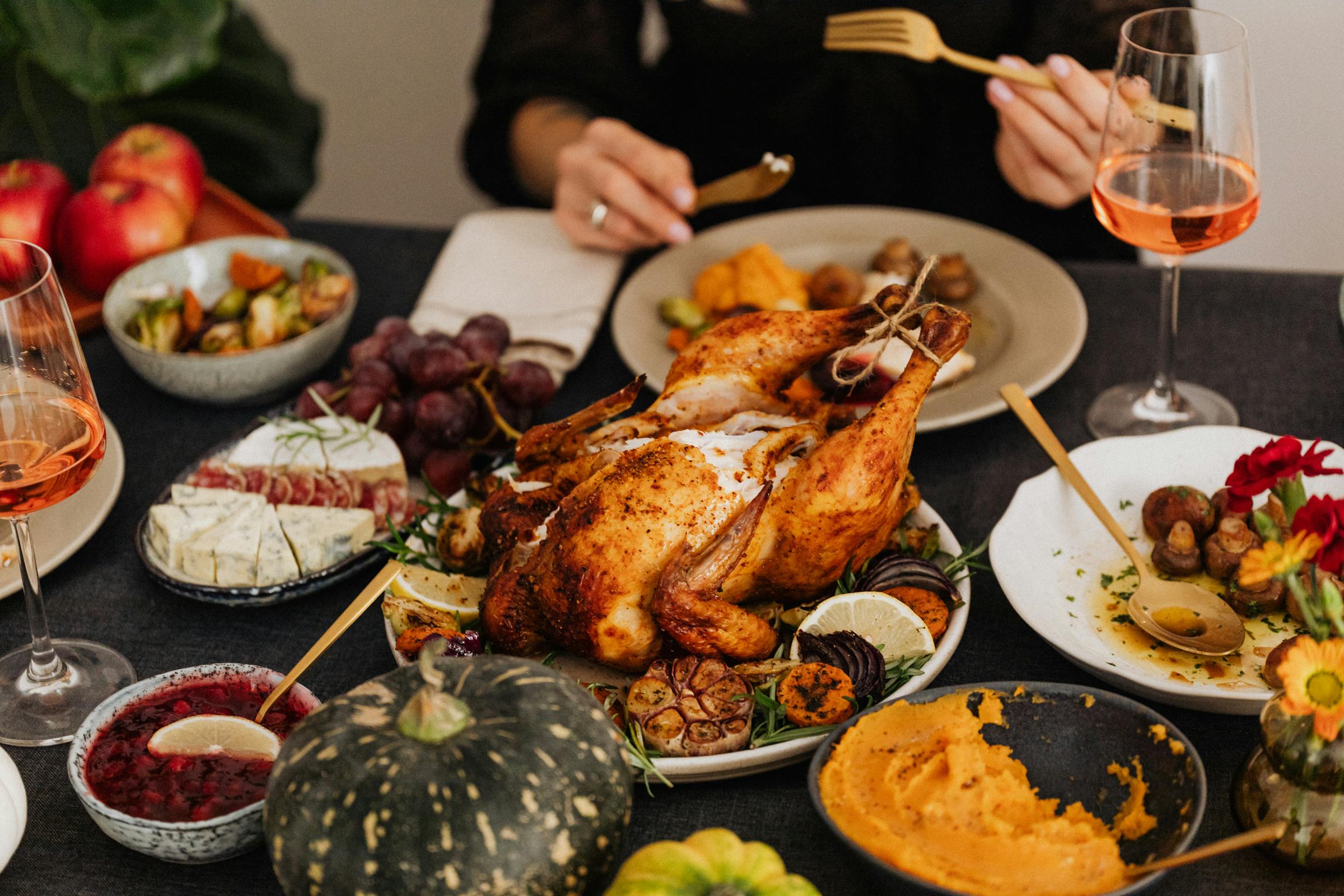 People eating a turkey dinner | Source: Pexels