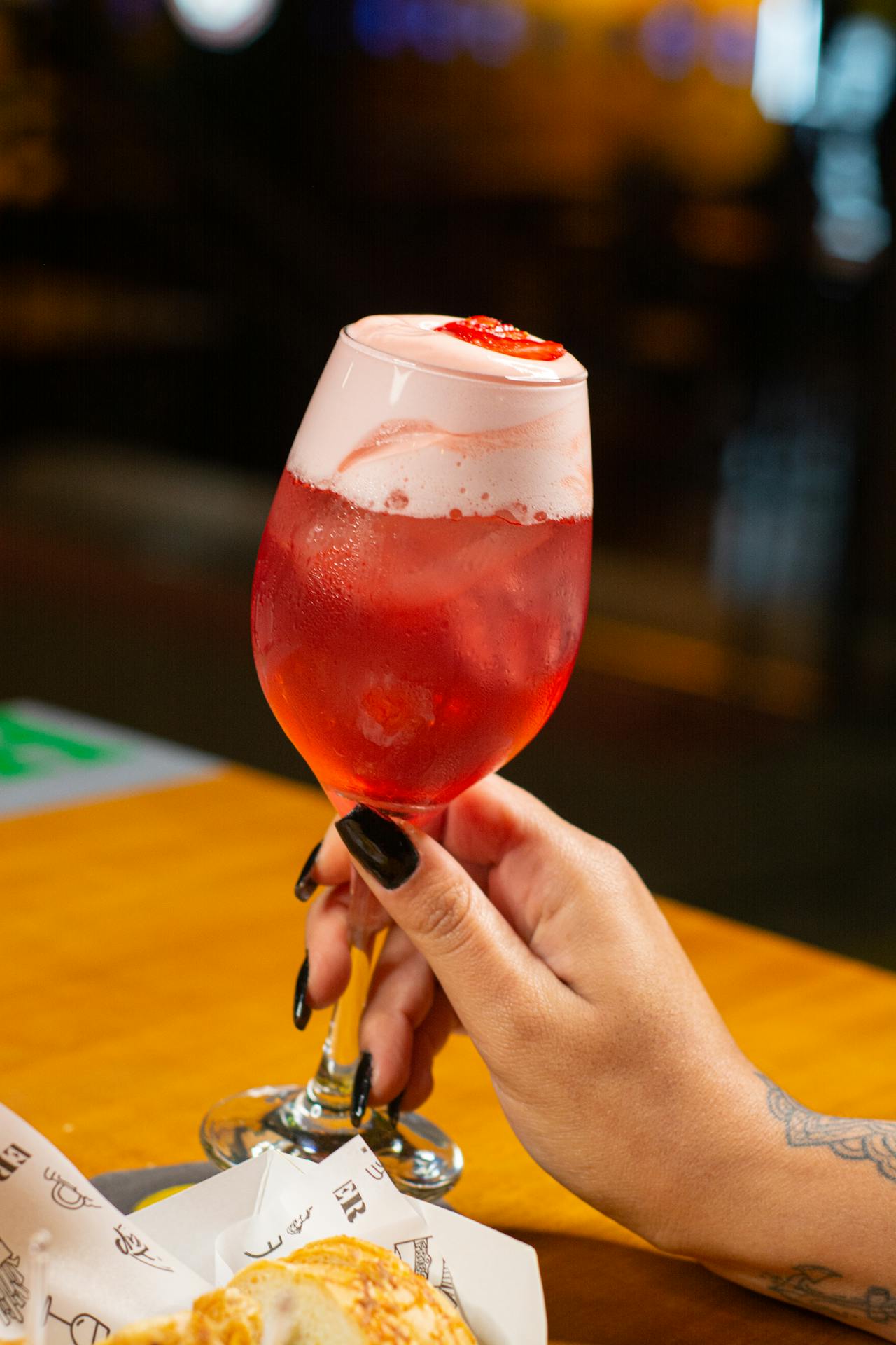 A woman holding a glass of juice | Source: Pexels