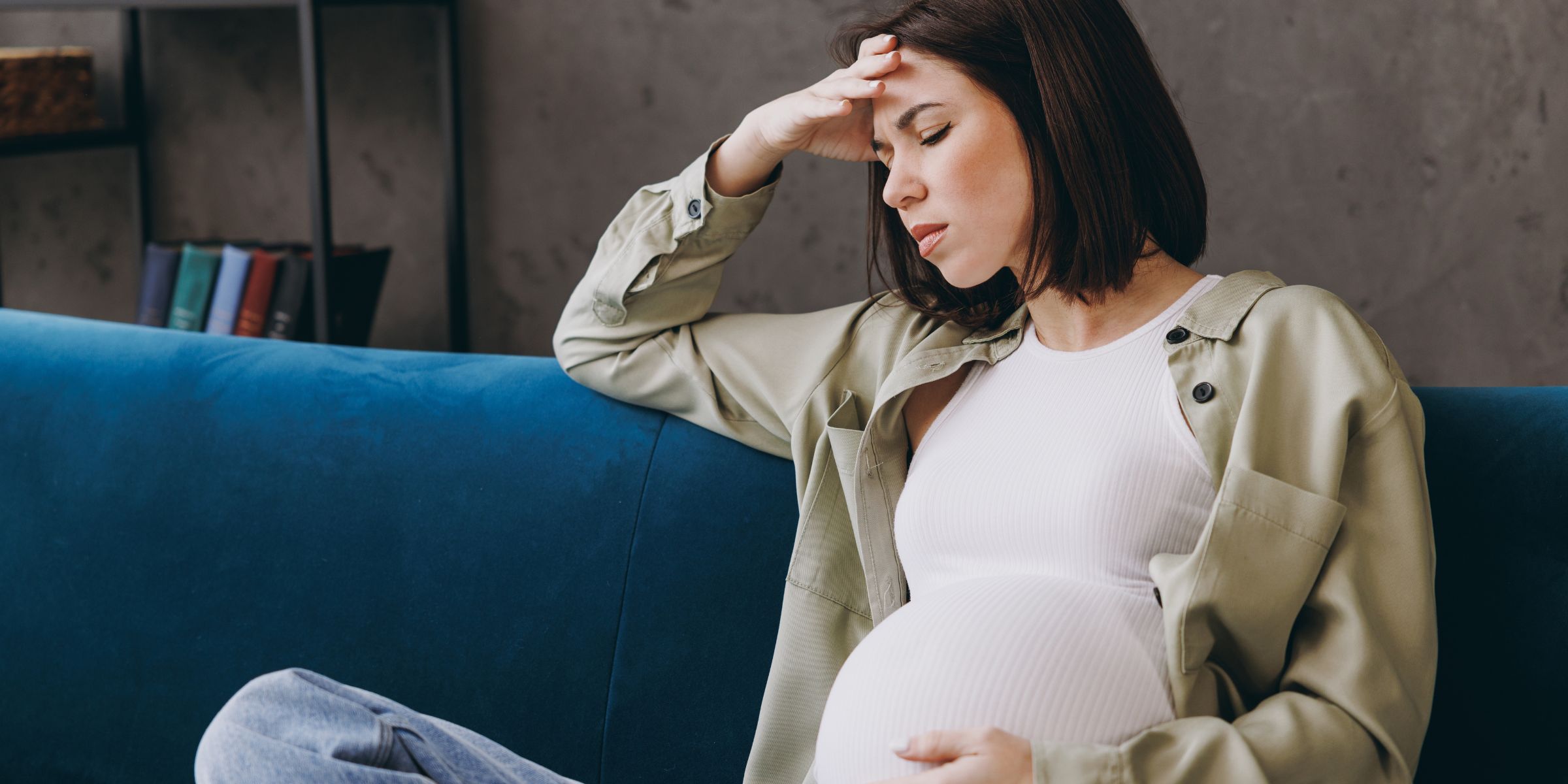 A sad and stressed pregnant woman | Source: Shutterstock