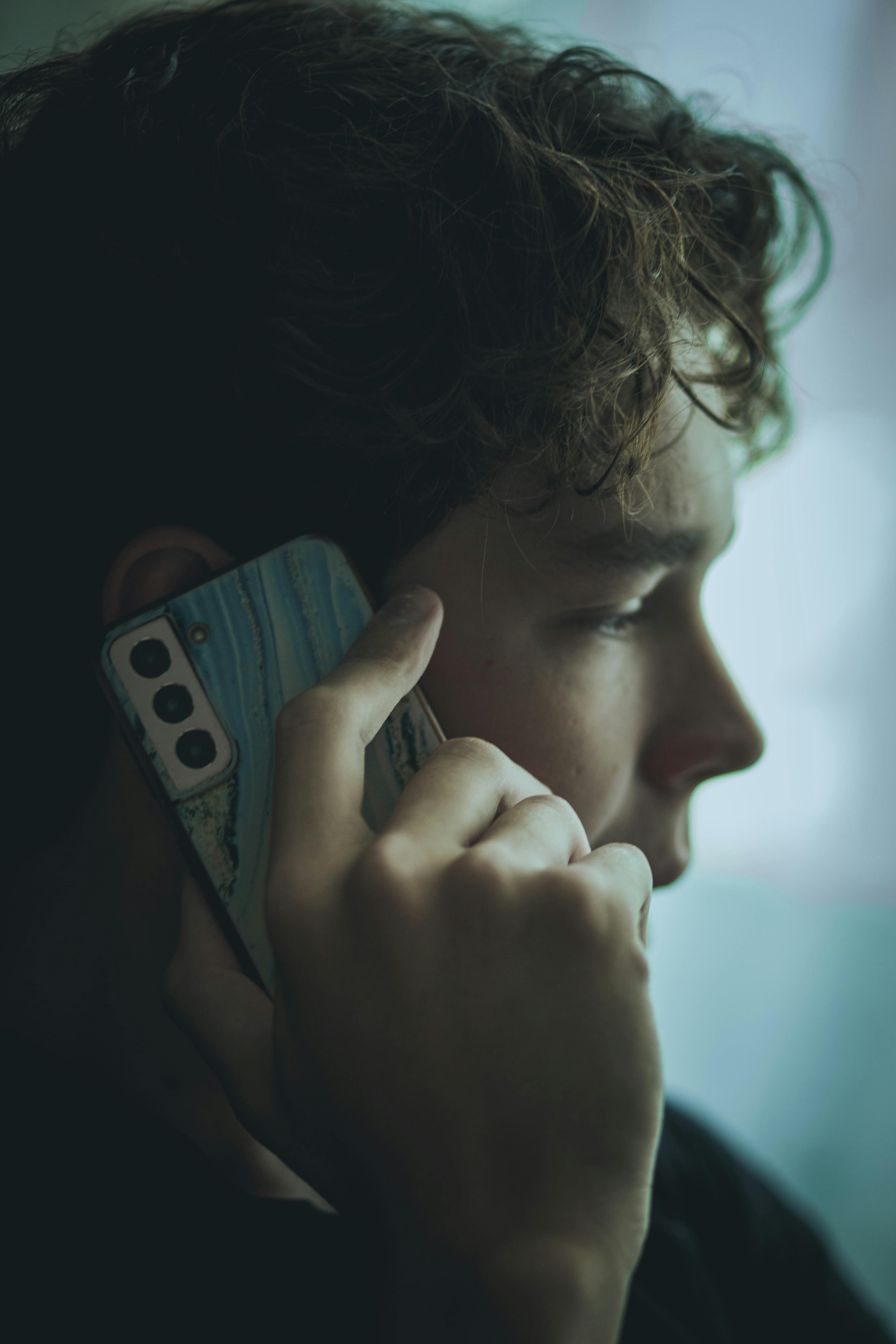 An unhappy man on a call | Source: Pexels