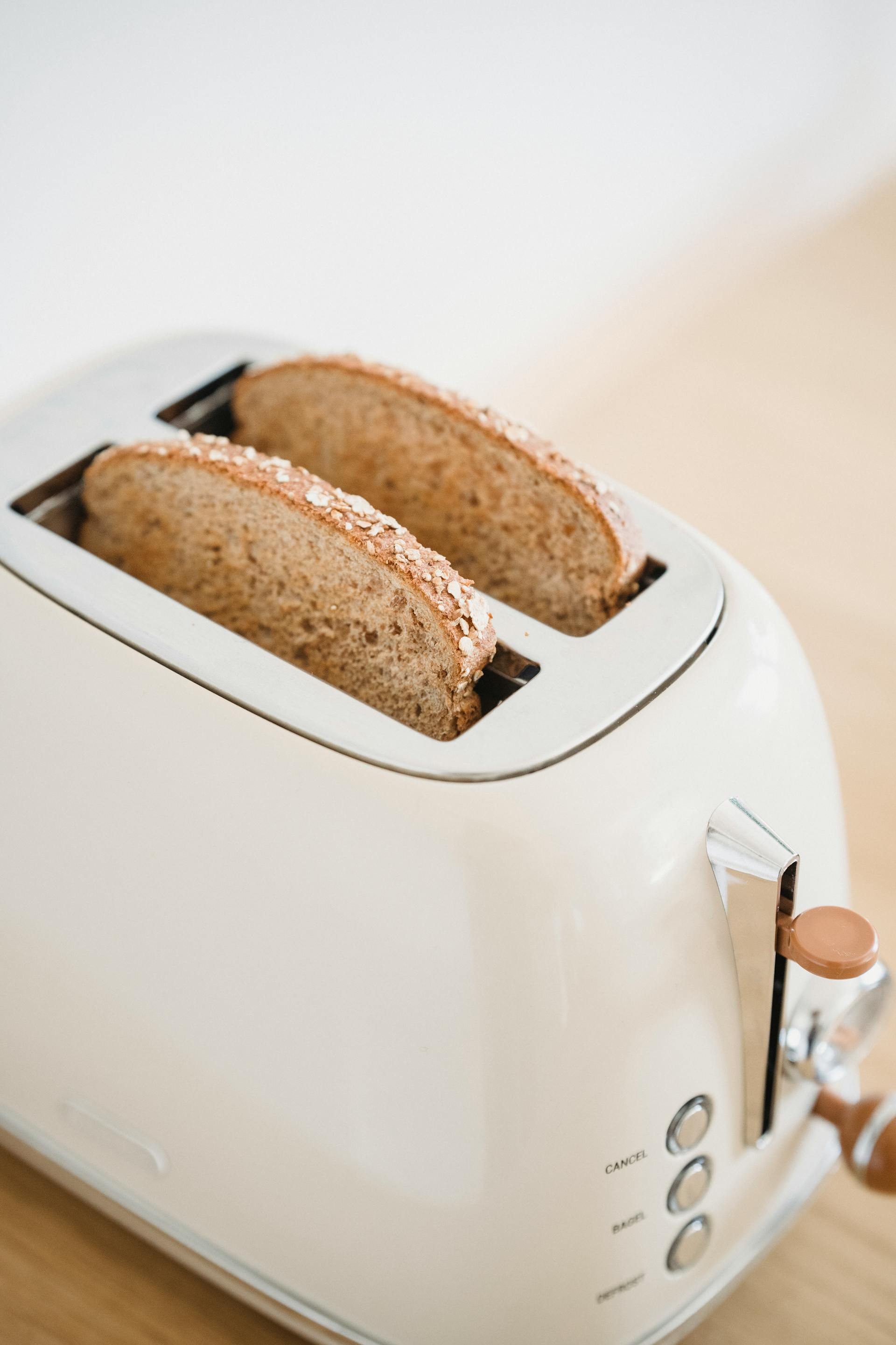 A close-up of bread slices in a toaster | Source: Pexels