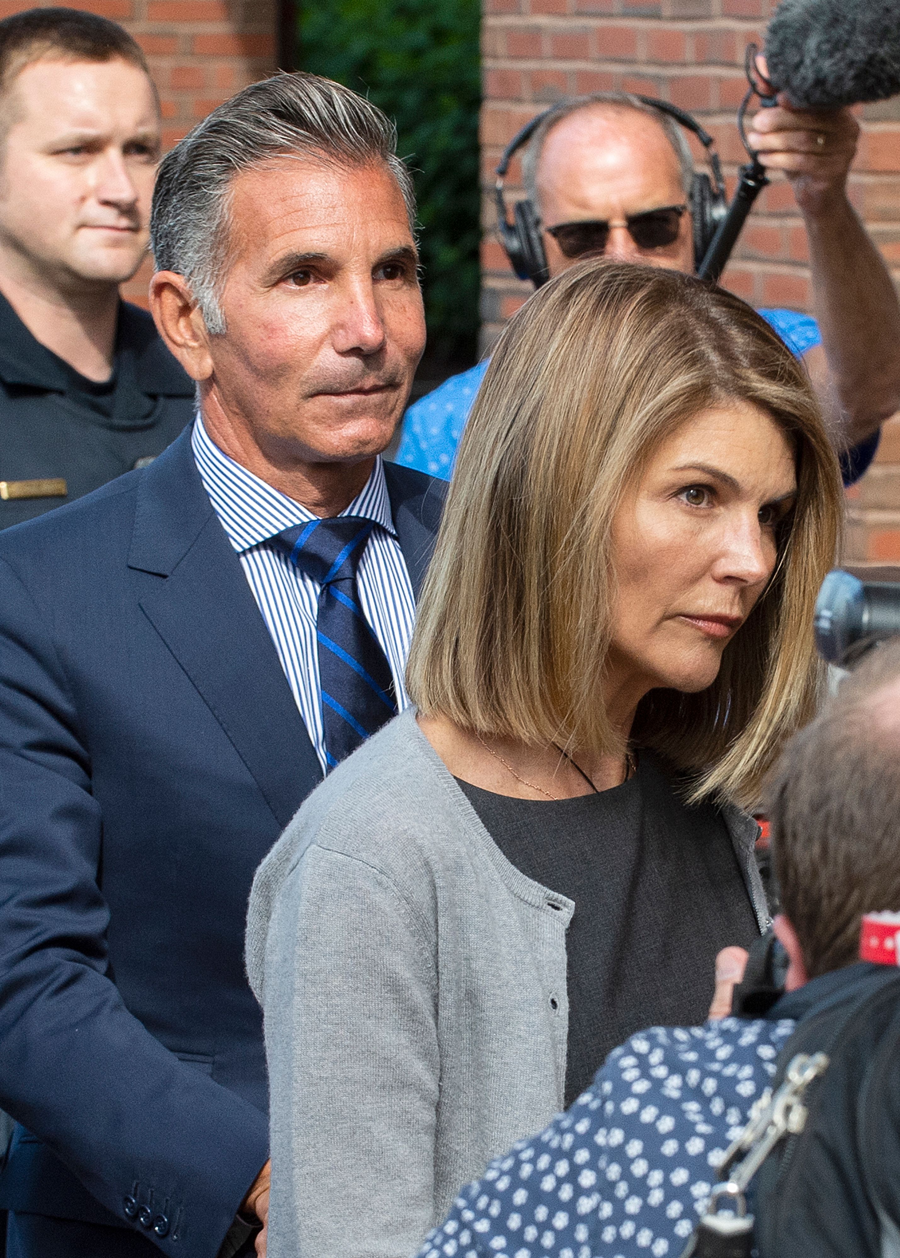 Lori Loughlin and her husband, Mossimo Giannulli, leave Moakley Federal Courthouse after a brief hearing on August 27, 2019, in Boston, Massachussetts. | Source: Getty Images