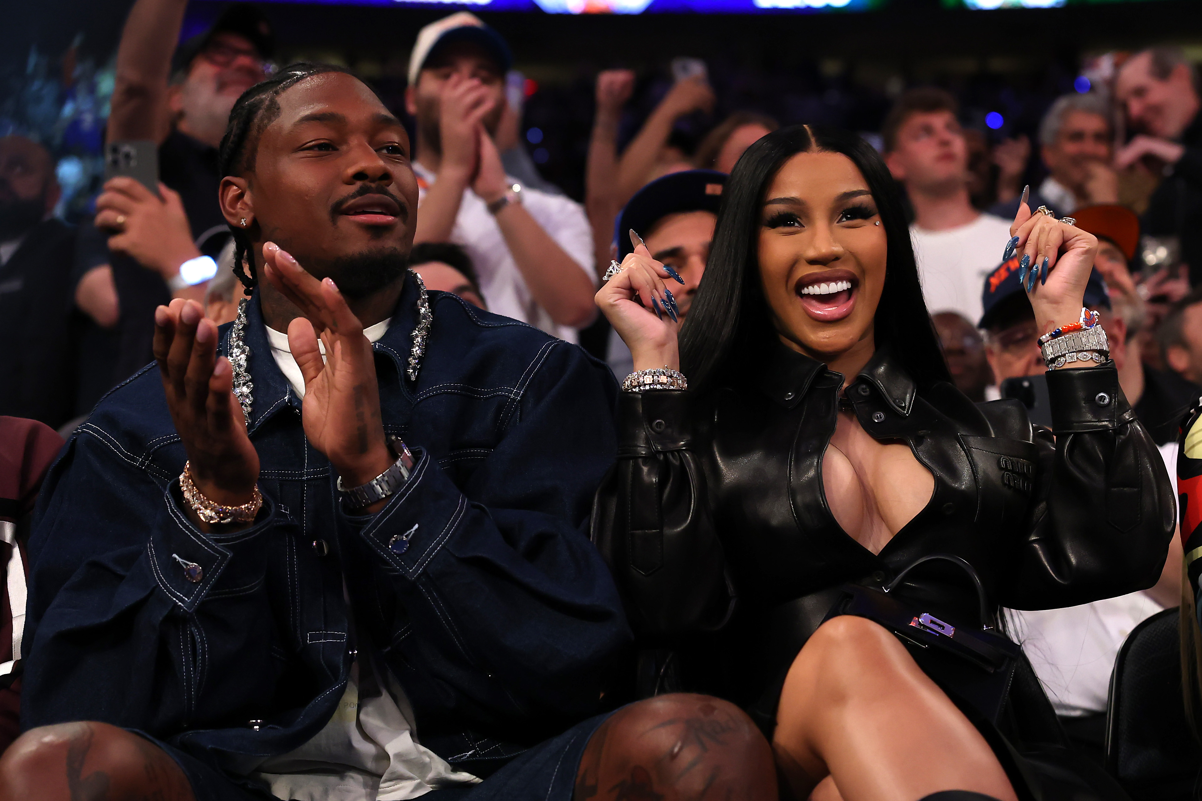Stefon Diggs and rapper Cardi B sits court-side during the first quarter in Game Four of the Eastern Conference Second Round NBA Playoffs between the Boston Celtics and the New York Knicks at Madison Square Garden on May 12, 2025, in New York City. | Source: Getty Images
