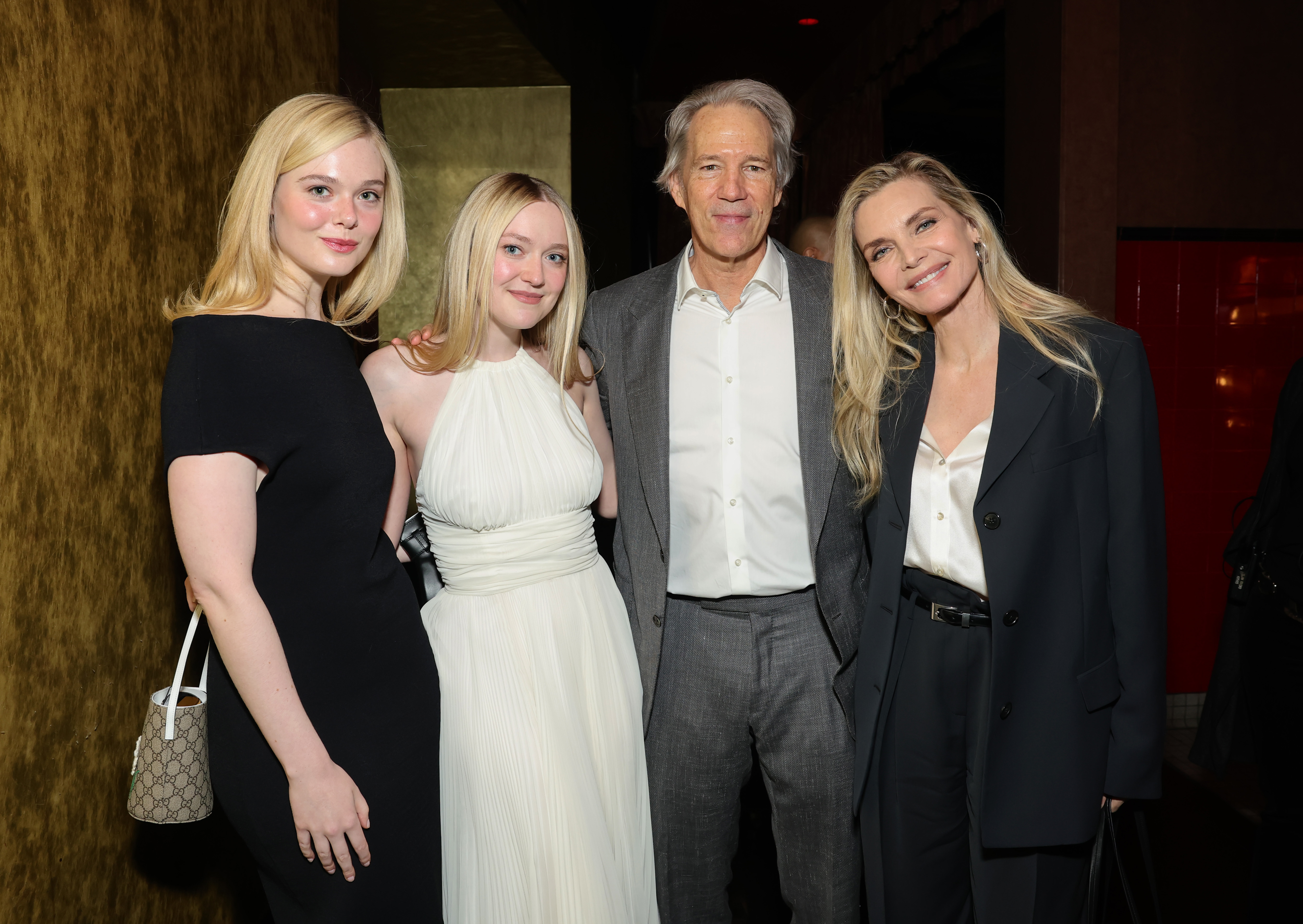(L-R) Elle Fanning, Dakota Fanning, David E. Kelley, and Michelle Pfeiffer are seen as TCM honors actress Michelle Pfeiffer with Hand and Footprint Ceremony at TCL Chinese Theatre on April 25, 2025, in Hollywood, California. | Source: Getty Images