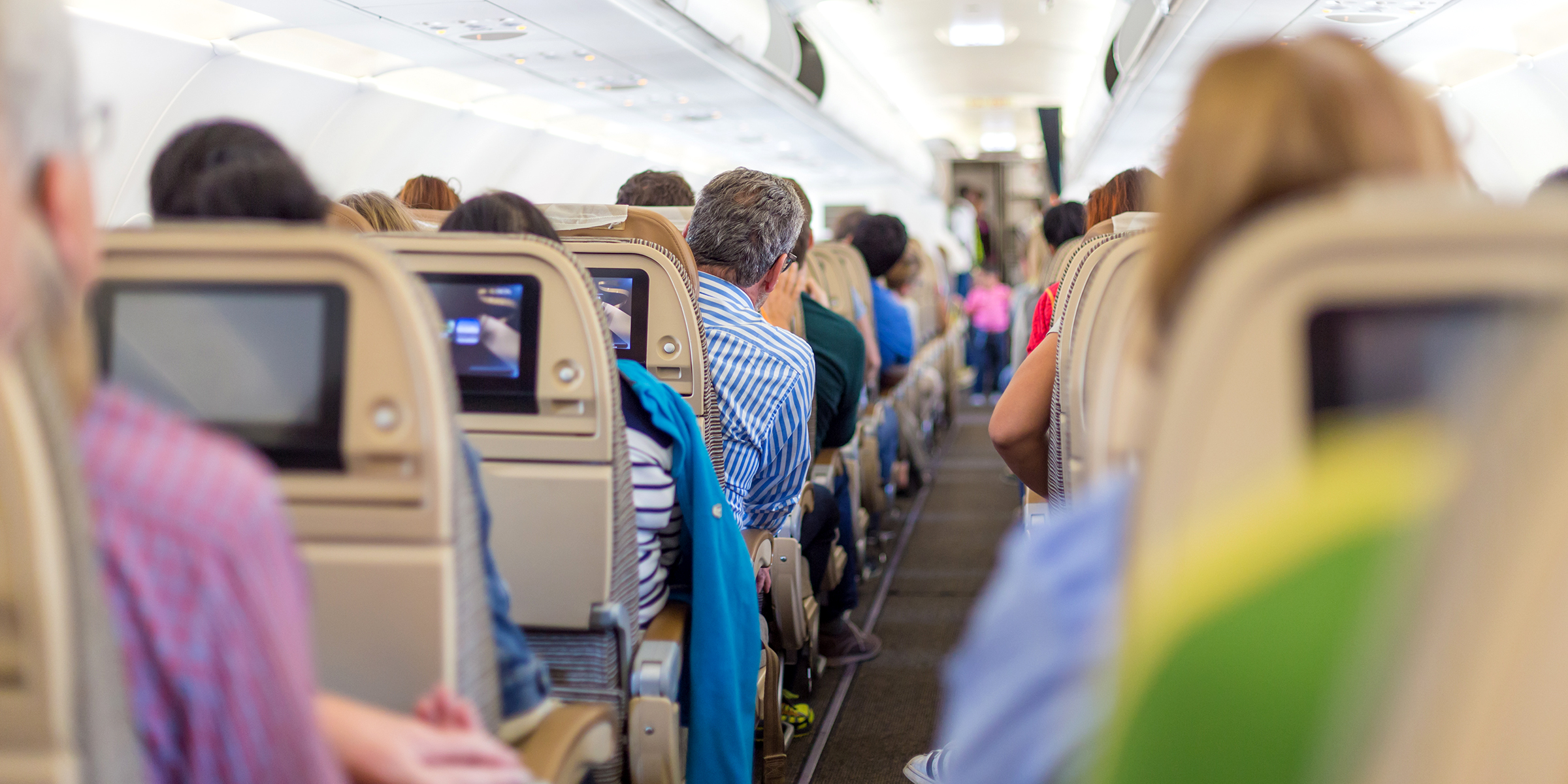 People sitting on a flight | Source: Shutterstock