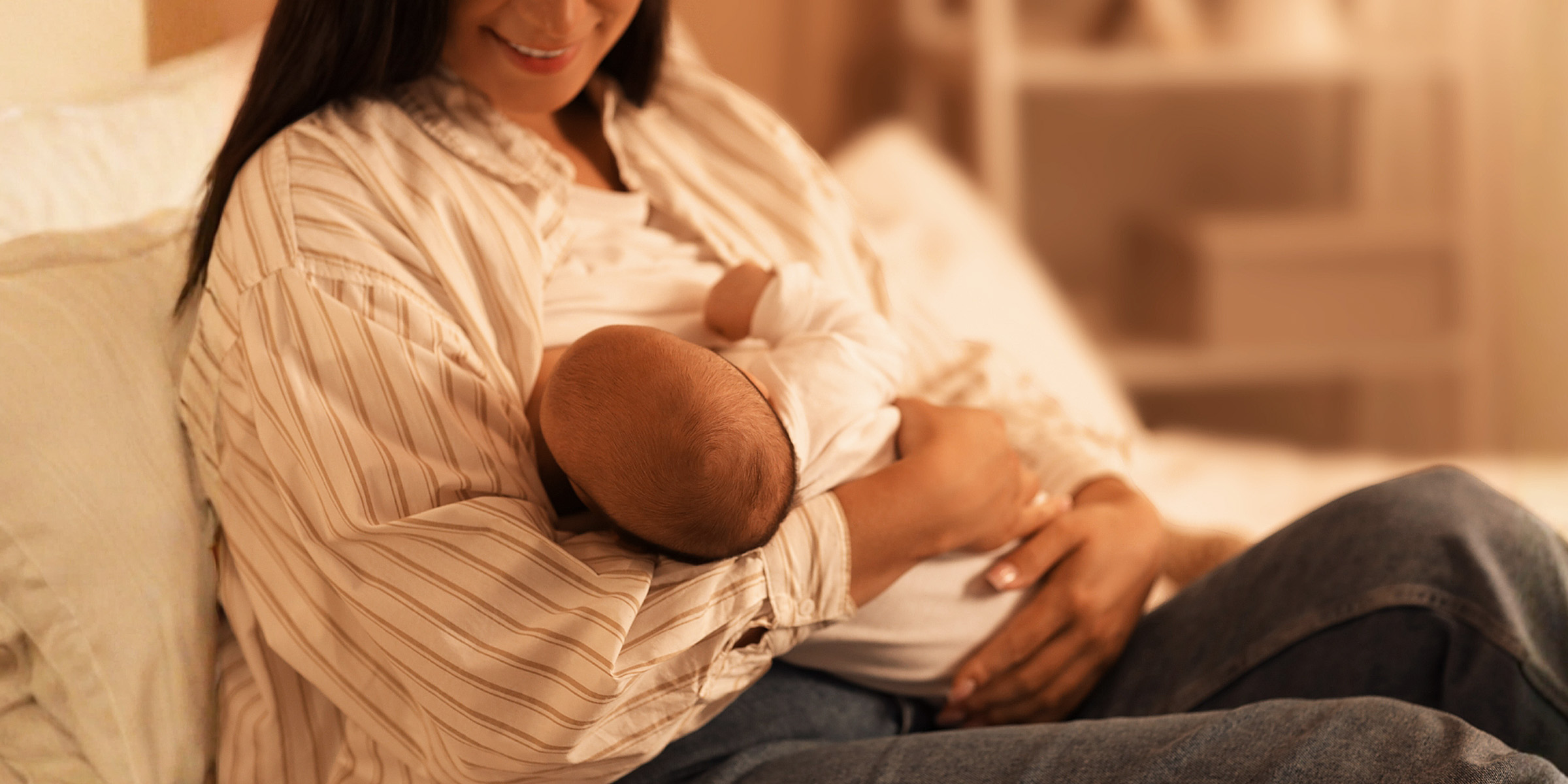 A woman feeding a baby | Source: Shutterstock