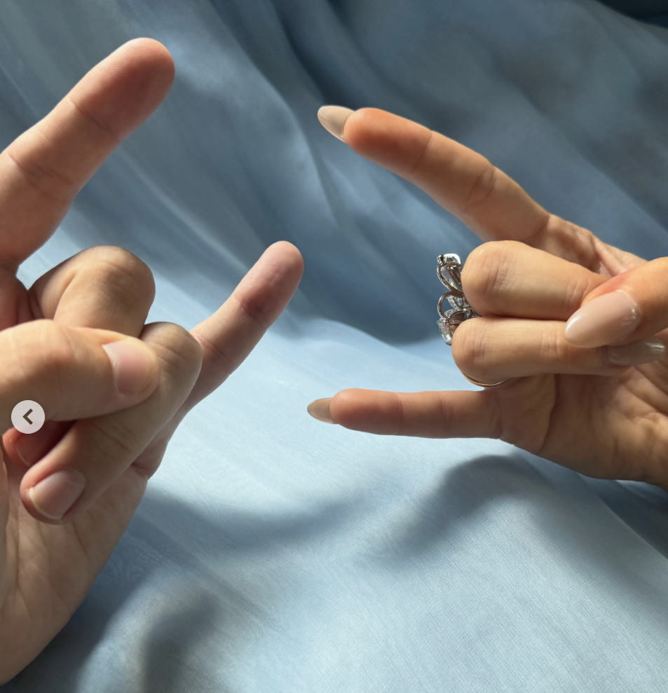 Dylan Sprouse and Barbara Palvin's hands doing the "rock on" sign, posted on May 14, 2026. | Source: Instagram/realbarbarapalvin