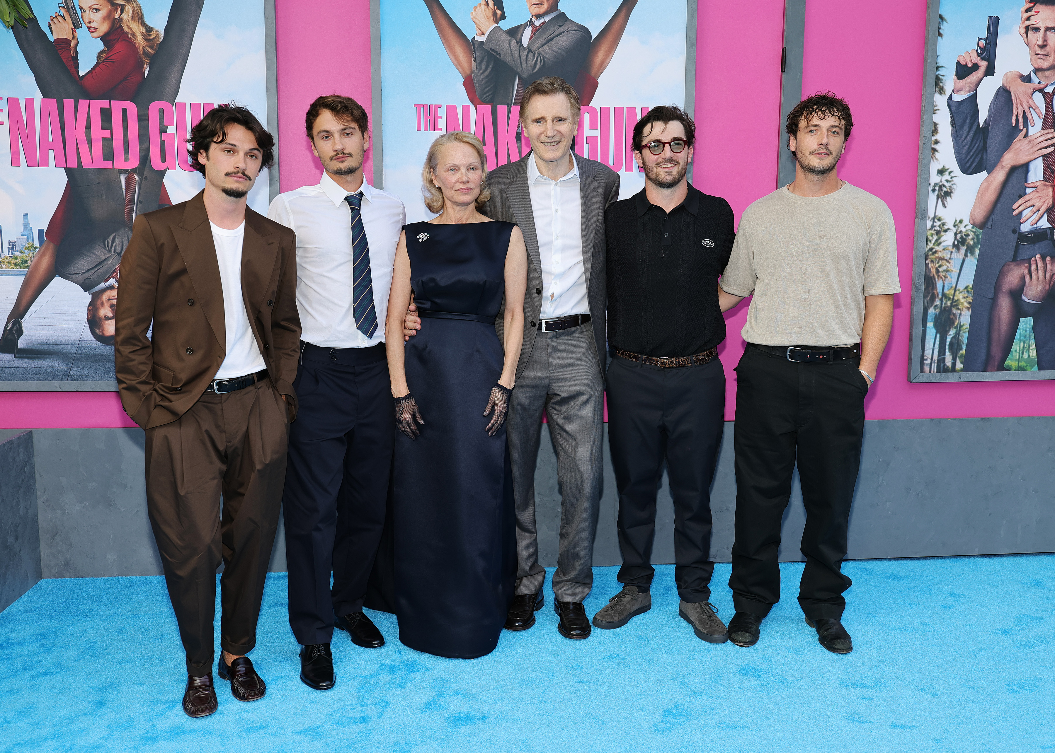 (L-R) Dylan Jagger Lee, Brandon Thomas Lee, Pamela Anderson, Liam Neeson, Daniel Neeson, and Micheál Neeson at the New York premiere of "The Naked Gun," 2025 | Source: Getty Images