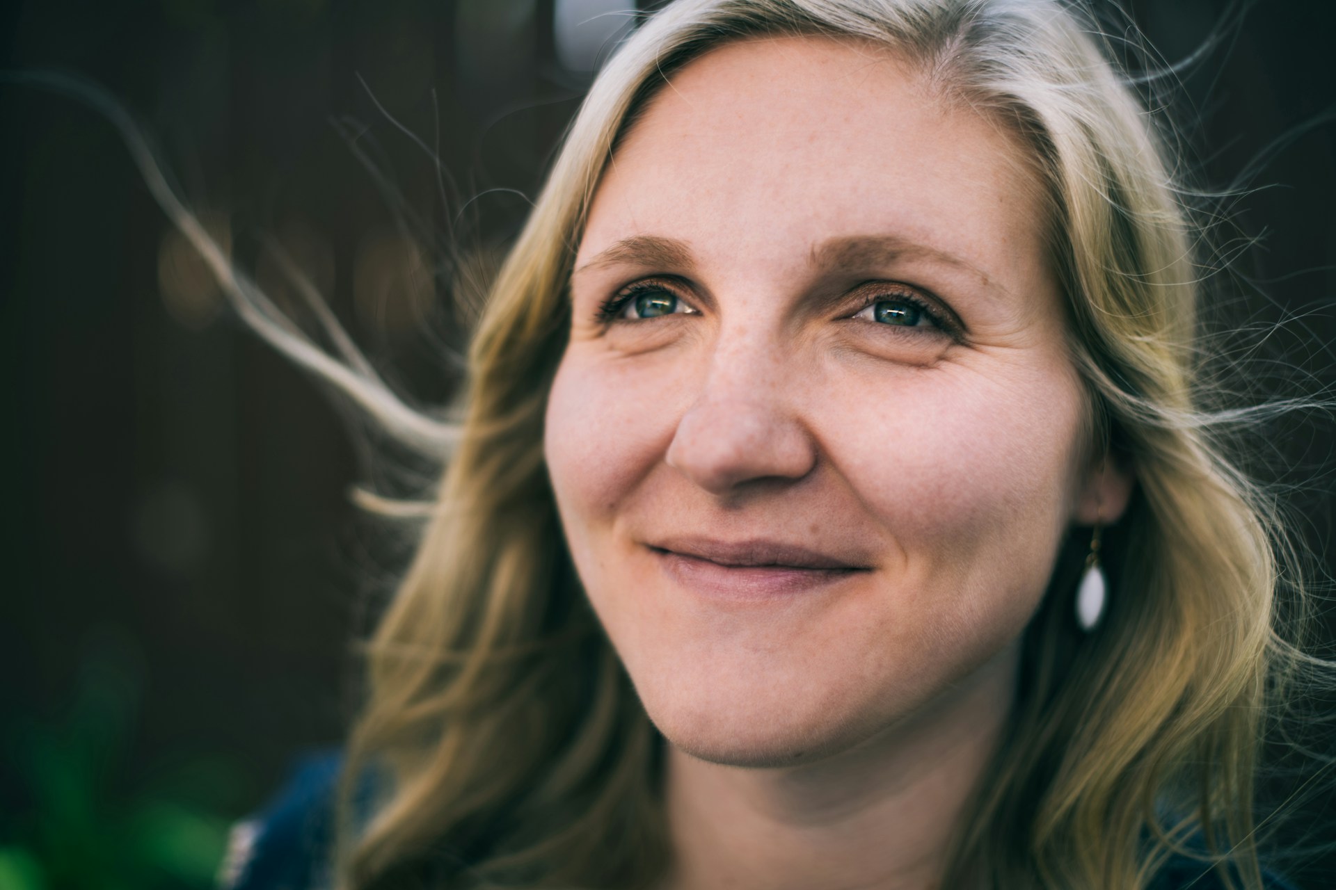 A woman smiling at someone | Source: Unsplash