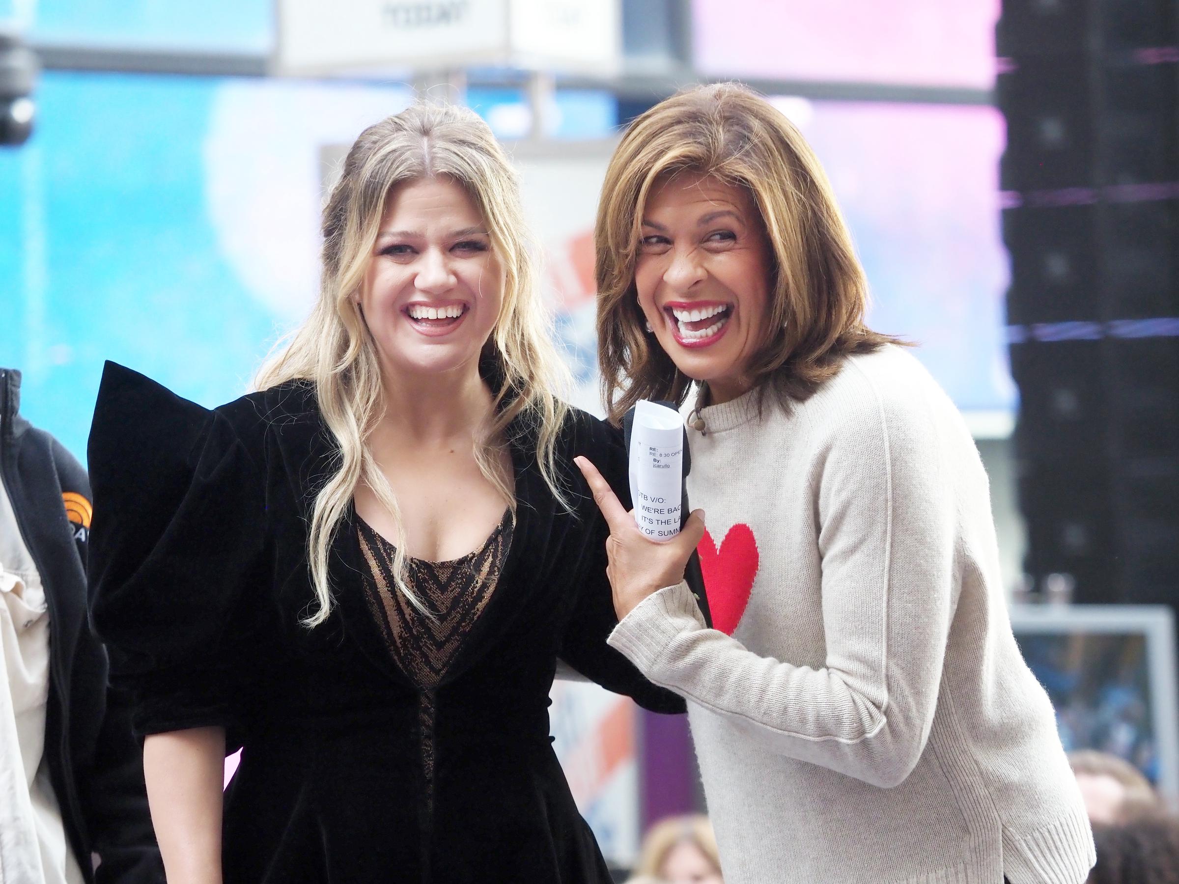 Kelly Clarkson and Hoda Kotb on NBC's "Today" show at Rockefeller Plaza on September 22, 2023, in New York City. | Source: Getty Images