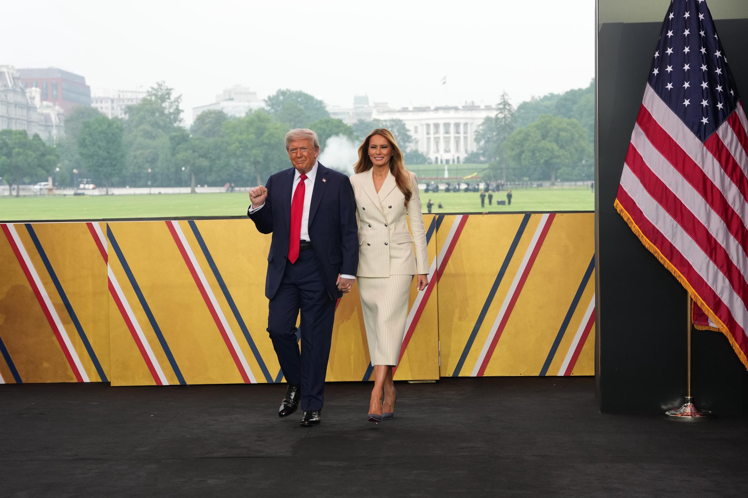 U.S. President Donald Trump and First Lady Melania Trump walk on stage during a celebration of the Army's 250th birthday on the National Mall on June 14, 2025 in Washington, DC | Source: Getty Images