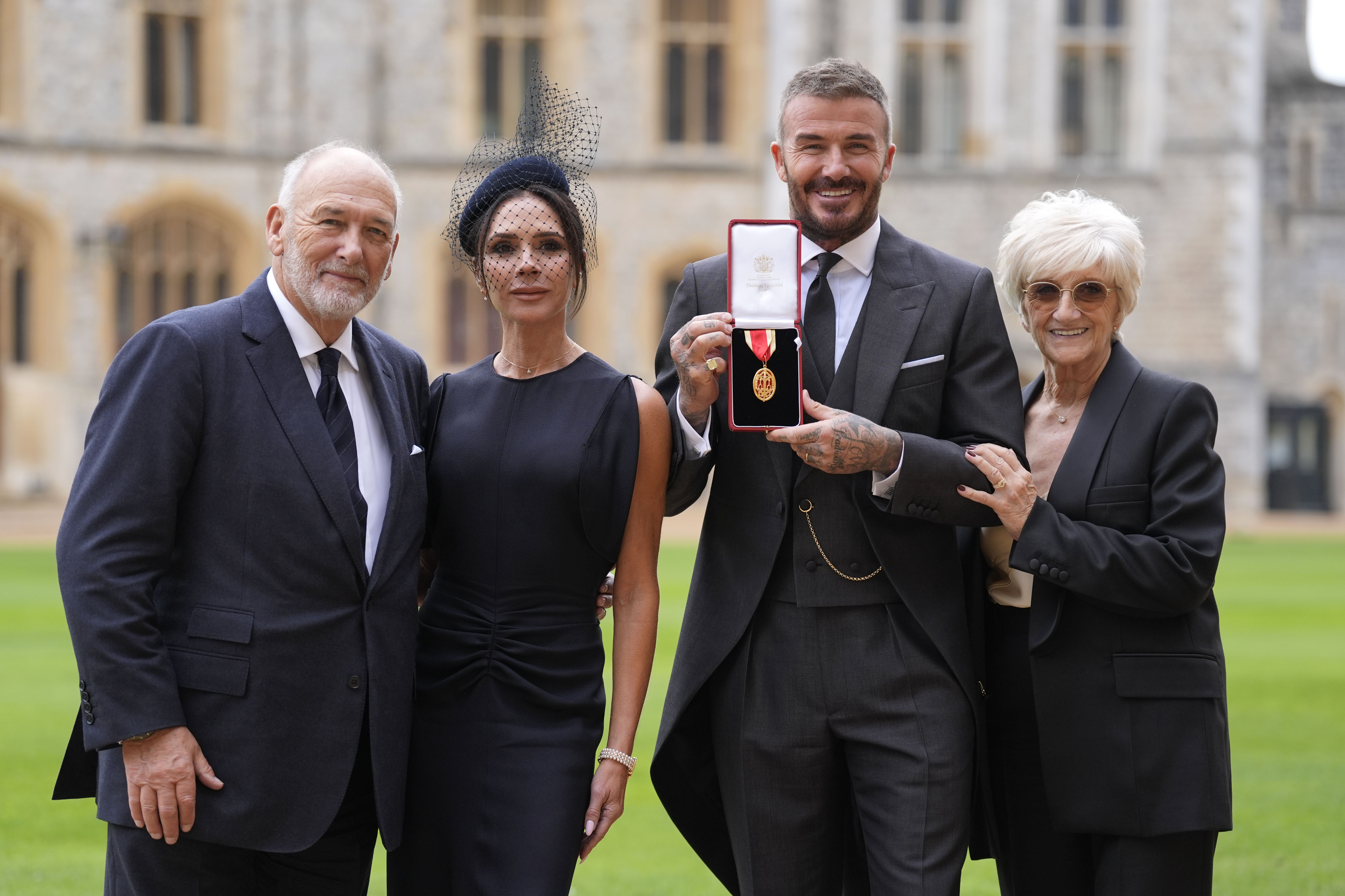 Sir David Beckham poses with his wife, Lady Victoria, and parents, Ted and Sandra Beckham, after he was made a Knight Bachelor at an investiture ceremony at Windsor Castle on November 4, 2025, in Windsor, England. | Source: Getty Images