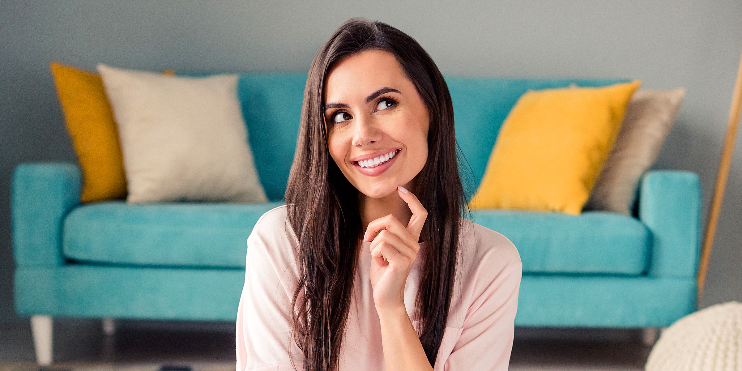 A woman smiling in a cunning way | Source: Shutterstock