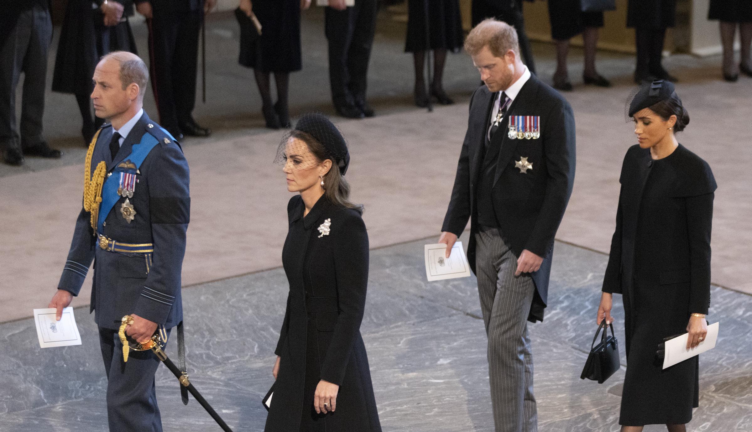 Prince William, Catherine, Princess of Wales, Harry, Duke of Sussex and Meghan, Duchess of Sussex arrive as the coffin bearing the body of Her majesty Queen Elizabeth II completes its Journey from Buckingham Palace to Westminster Hall on September 14, 2022 in London, England | Source: Getty Images