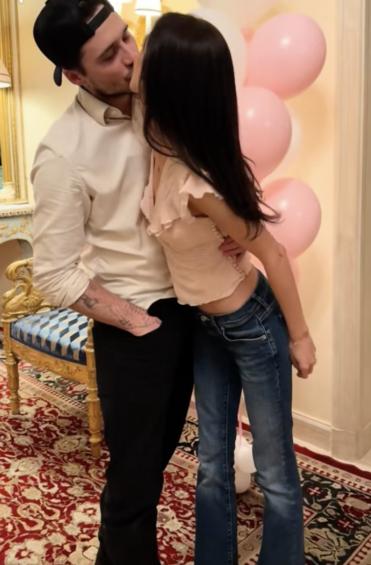 Brooklyn Beckham and Nicola Peltz Beckham sharing a kiss during her birthday celebration, posted on January 4, 2026. | Source: TikTok/@nicolapeltzbeckham