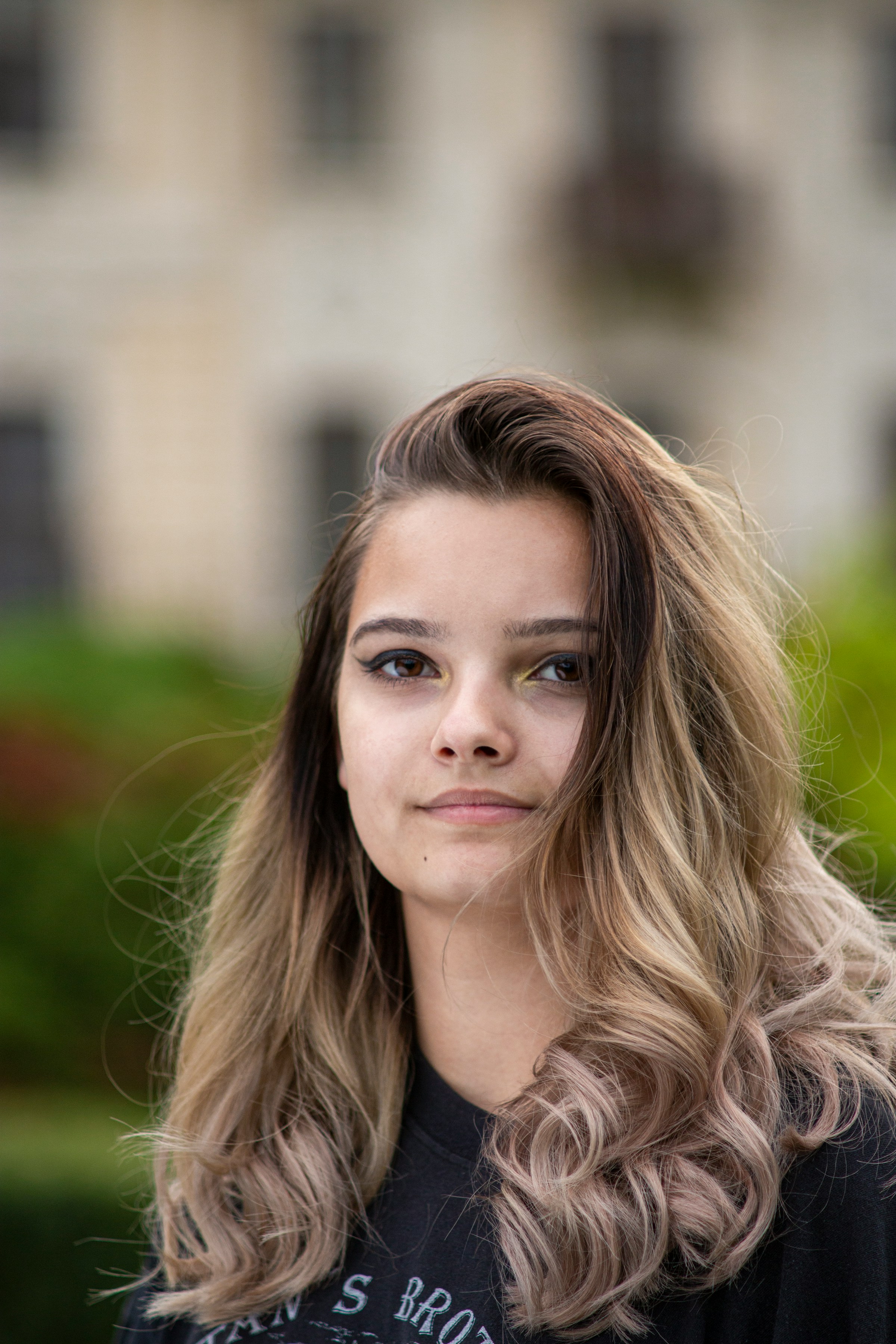 A teenage girl with a small smile | Source: Unsplash