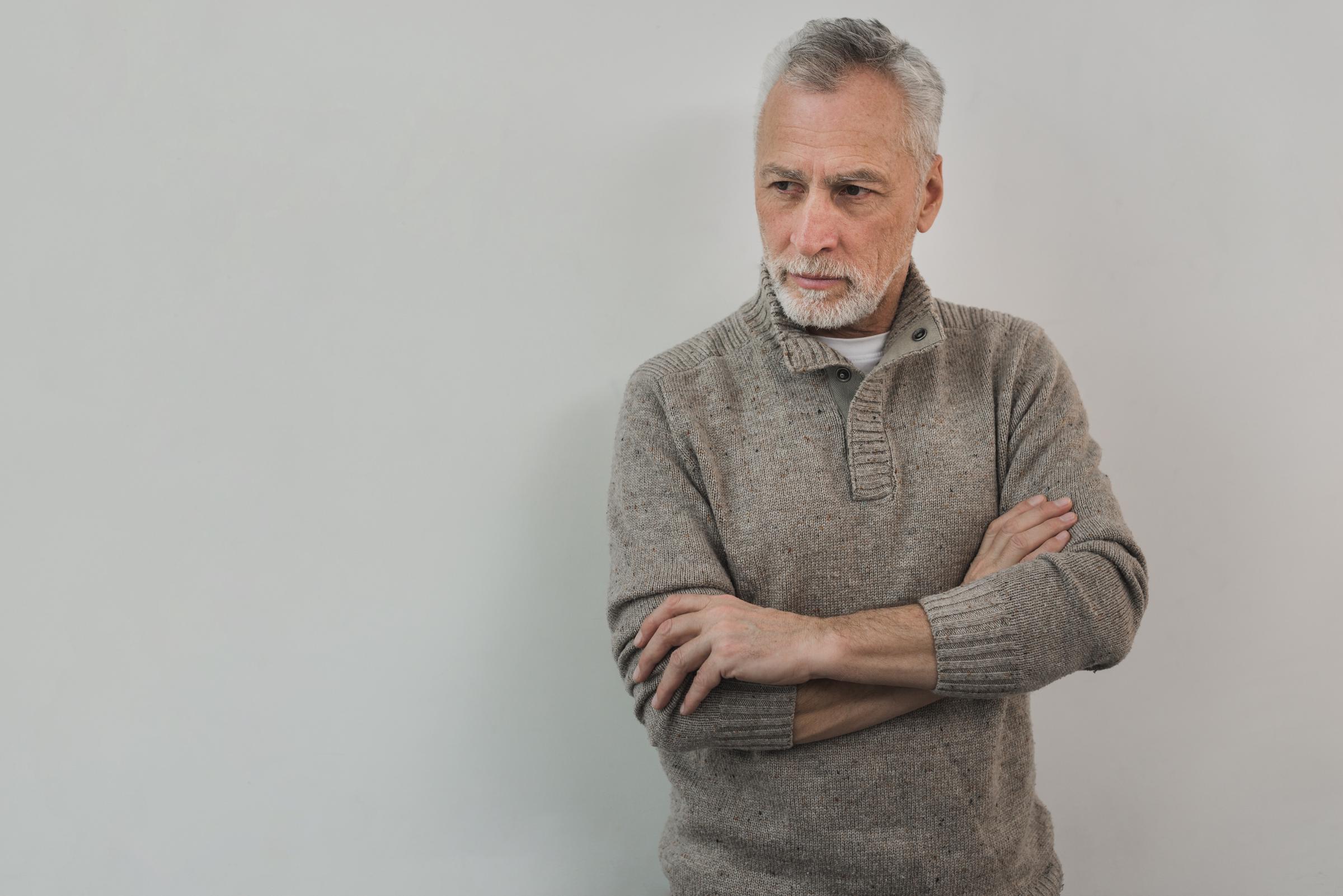 A stressed man standing | Source: Freepik