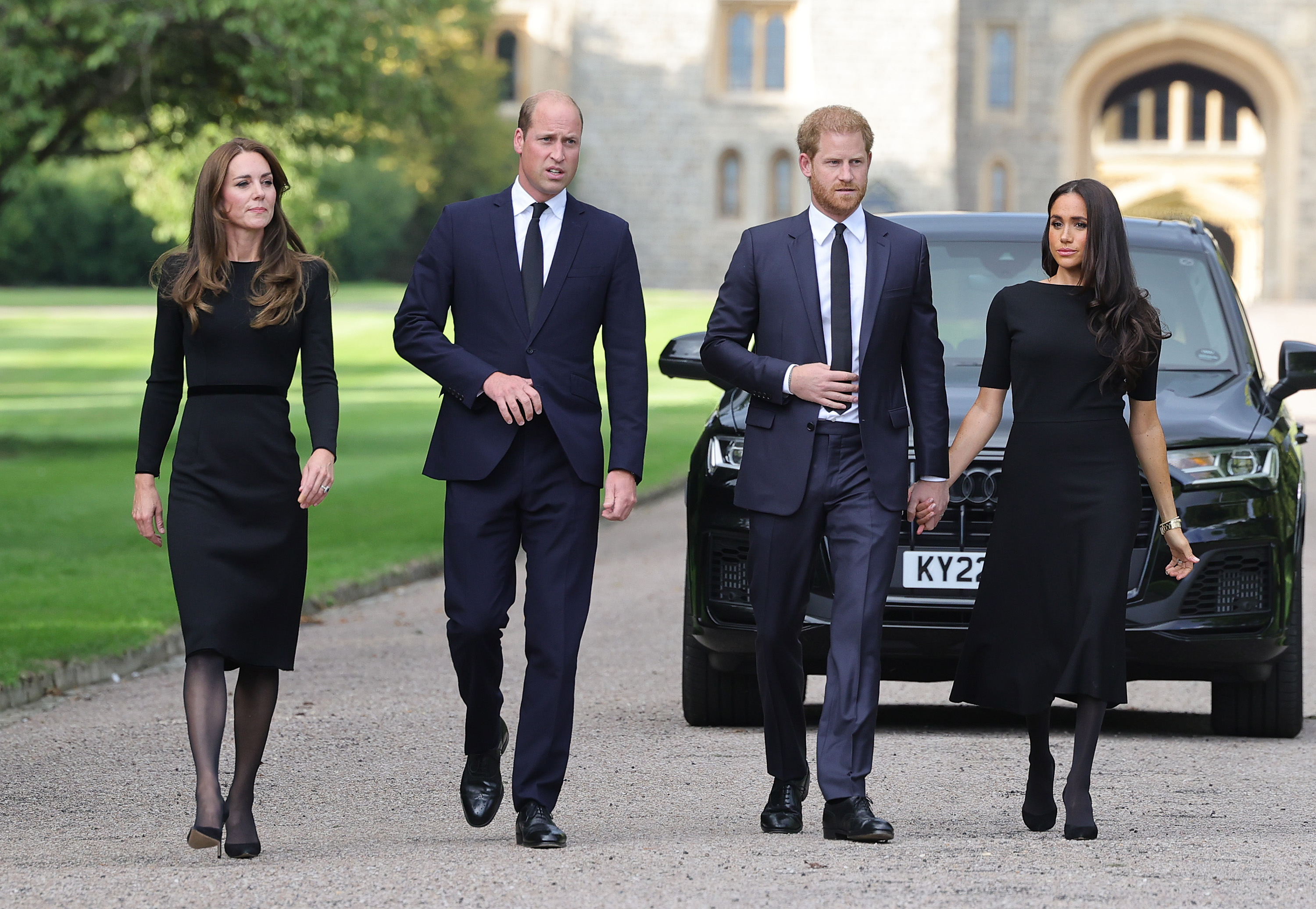 Catherine, Princess of Wales, Prince William, Prince of Wales, Prince Harry, Duke of Sussex, and Meghan, Duchess of Sussex on the long Walk at Windsor Castle arrive to view flowers and tributes to HM Queen Elizabeth on September 10, 2022 in Windsor, England. | Source: Getty Images