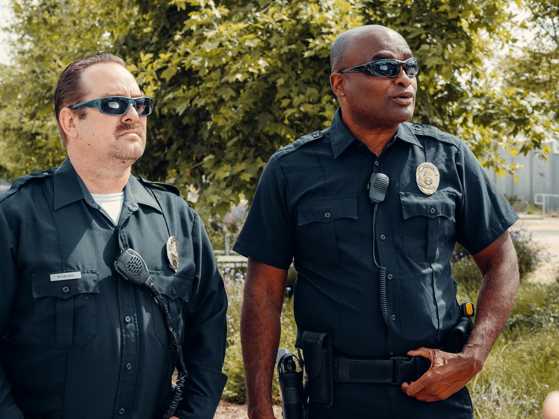 Two police officers standing outside | Source: Pexels