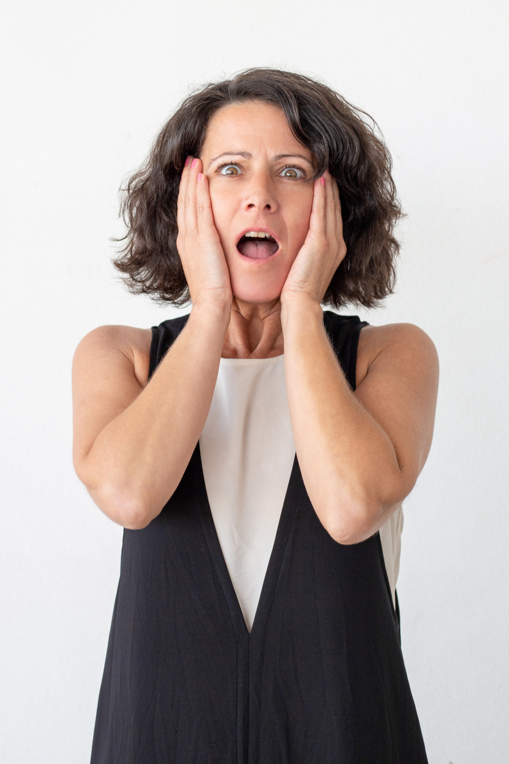 A startled woman | Source: Freepik