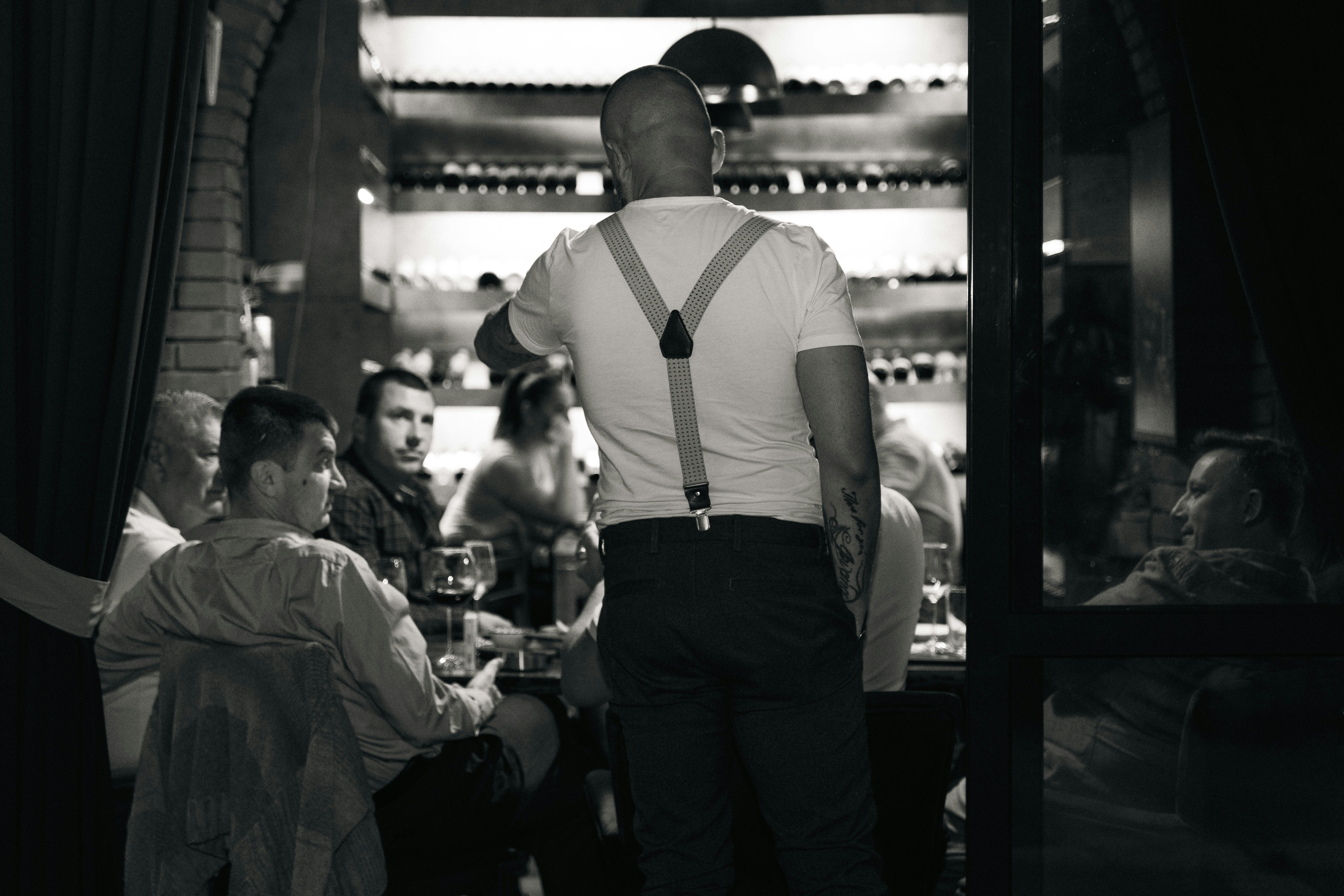 A man standing in a restaurant | Source: Unsplash