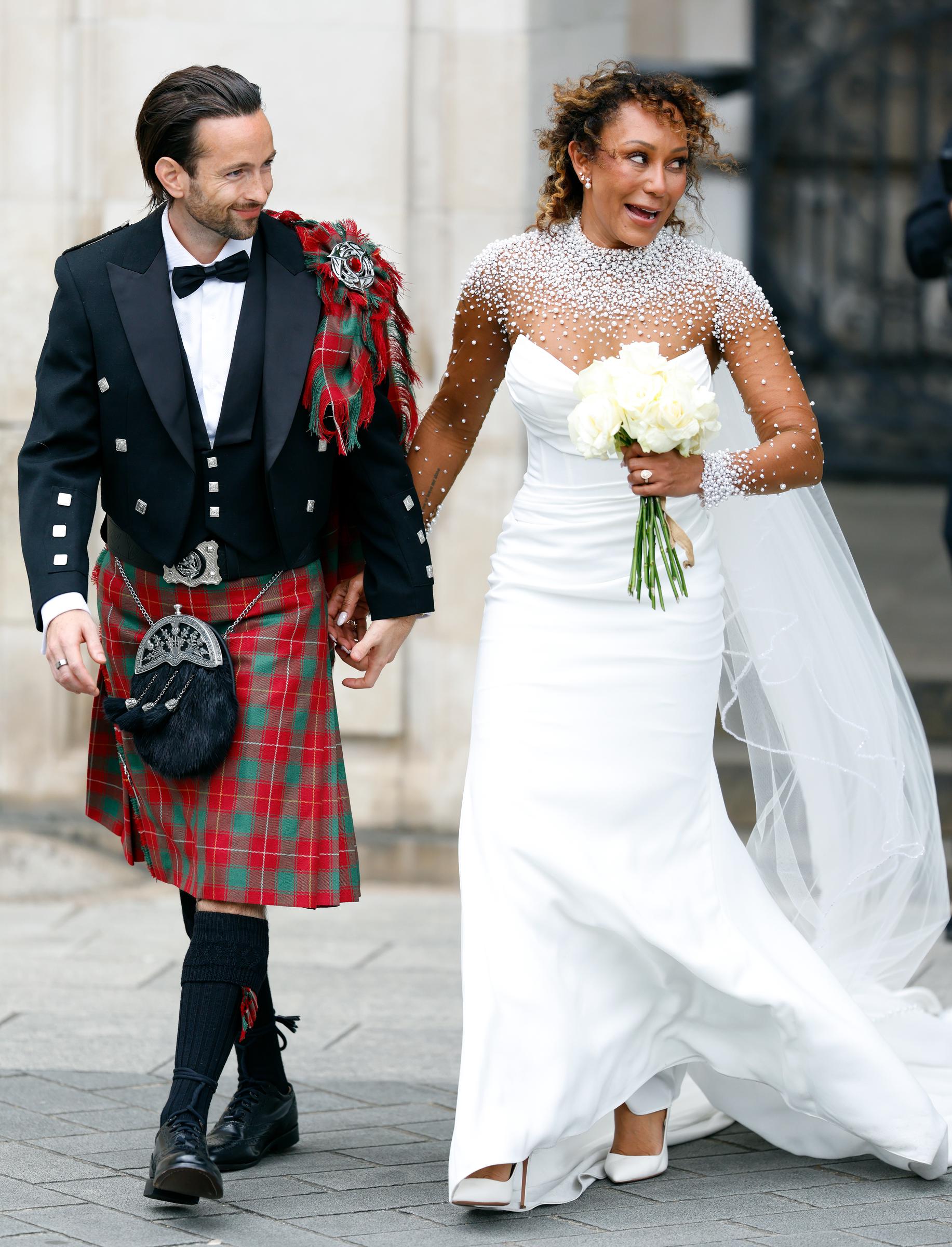 Rory McPhee and Mel B depart following their wedding in the OBE (Order of the British Empire) Chapel at St Paul's Cathedral on July 5, 2025, in London, England. | Source: Getty Images