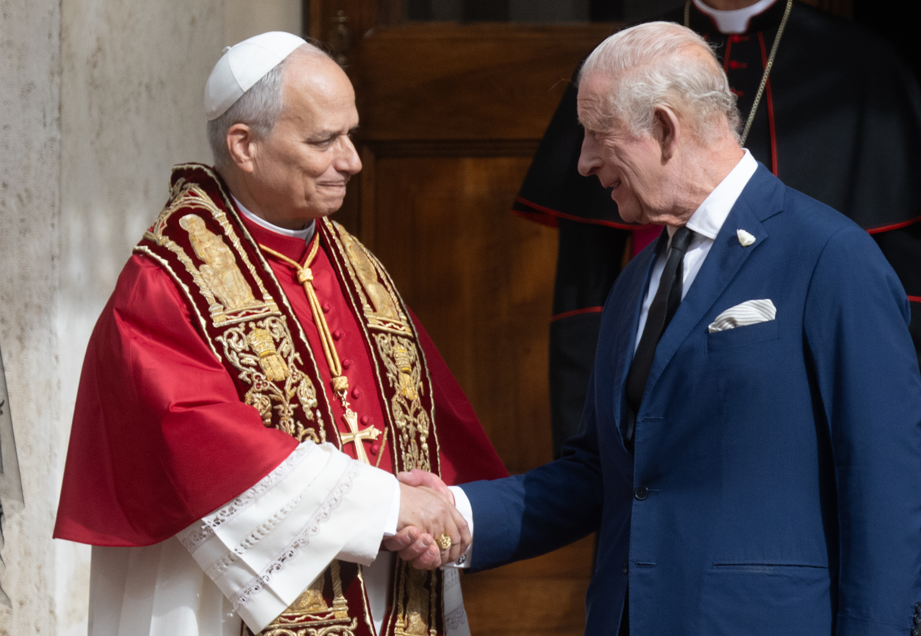 Pope Leo XIV greets King Charles III in the San Damaso courtyard at the Vatican after the state visit and praying together in the Sistine Chapel. | Source: Getty Images