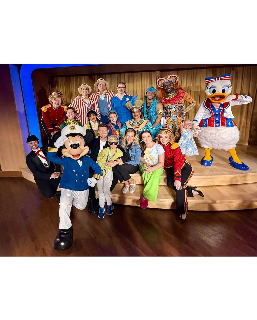 Michael Bublé poses with family and staff on Disney Cruise in post shared on July 29, 2025. | Source: Instagram/michaelbuble