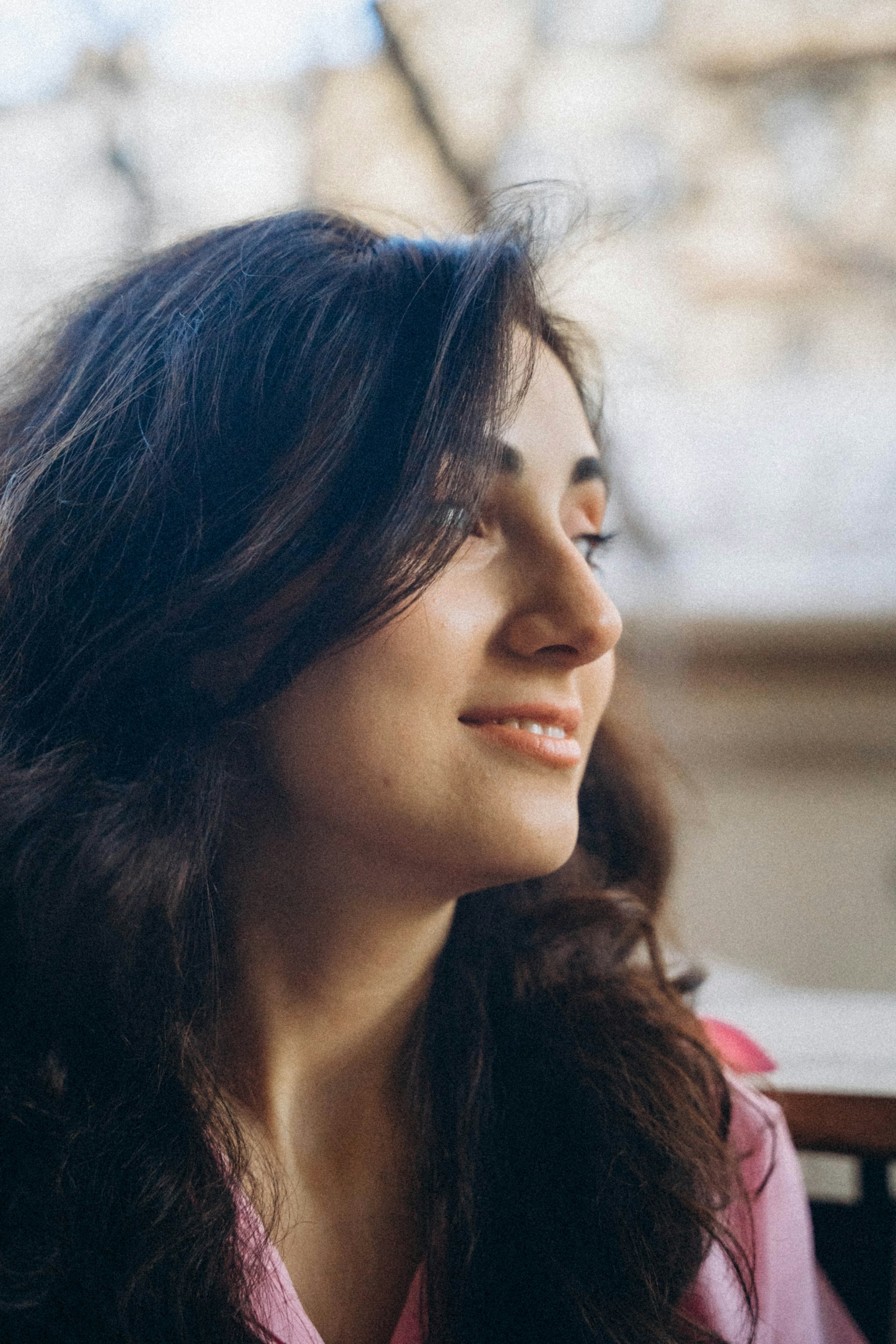A woman smiling at someone | Source: Unsplash