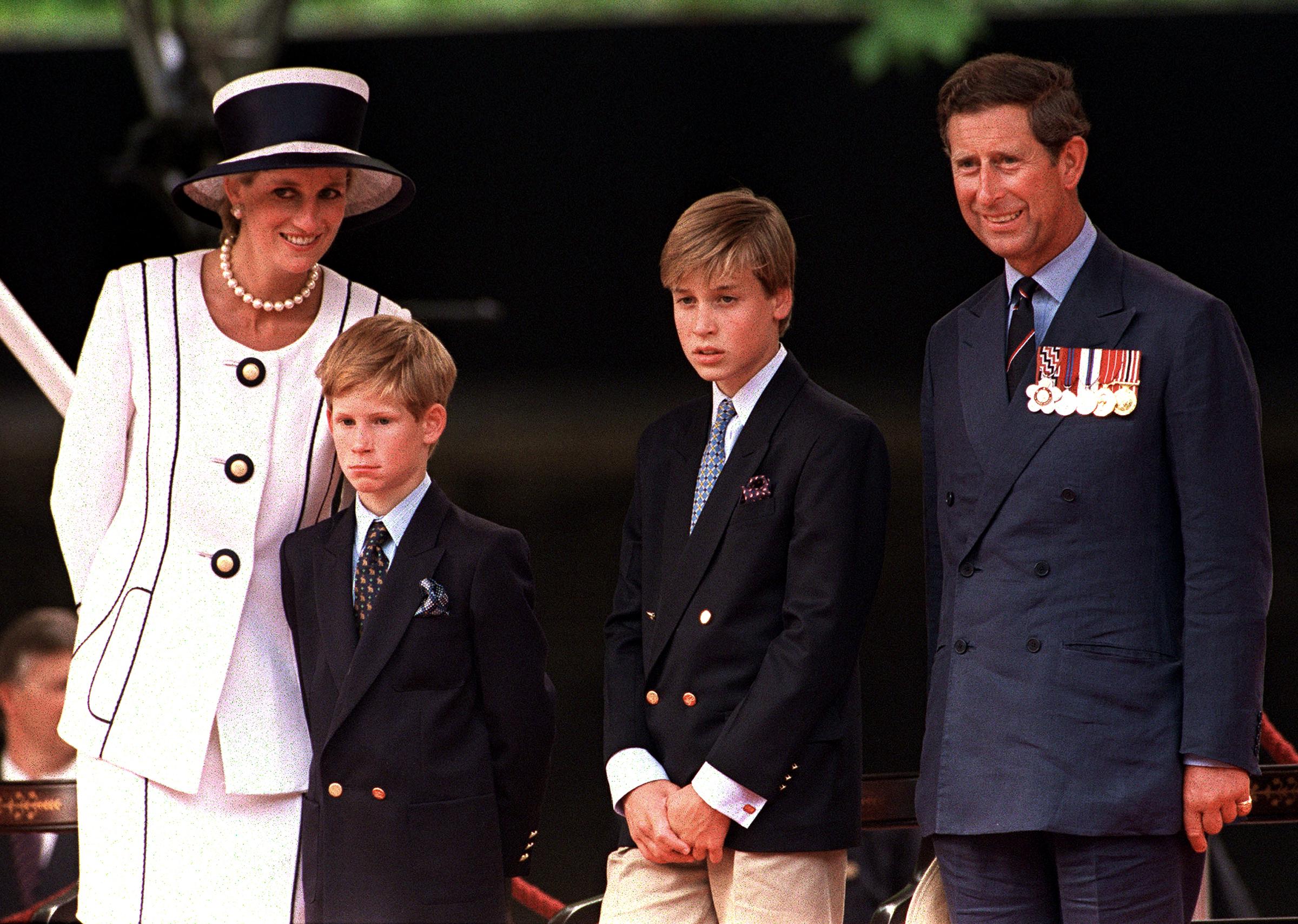 Prince Harry, Prince William and Prince Charles at a parade in the Mall, London, during V.J. Day commemorations on August 1, 1994.