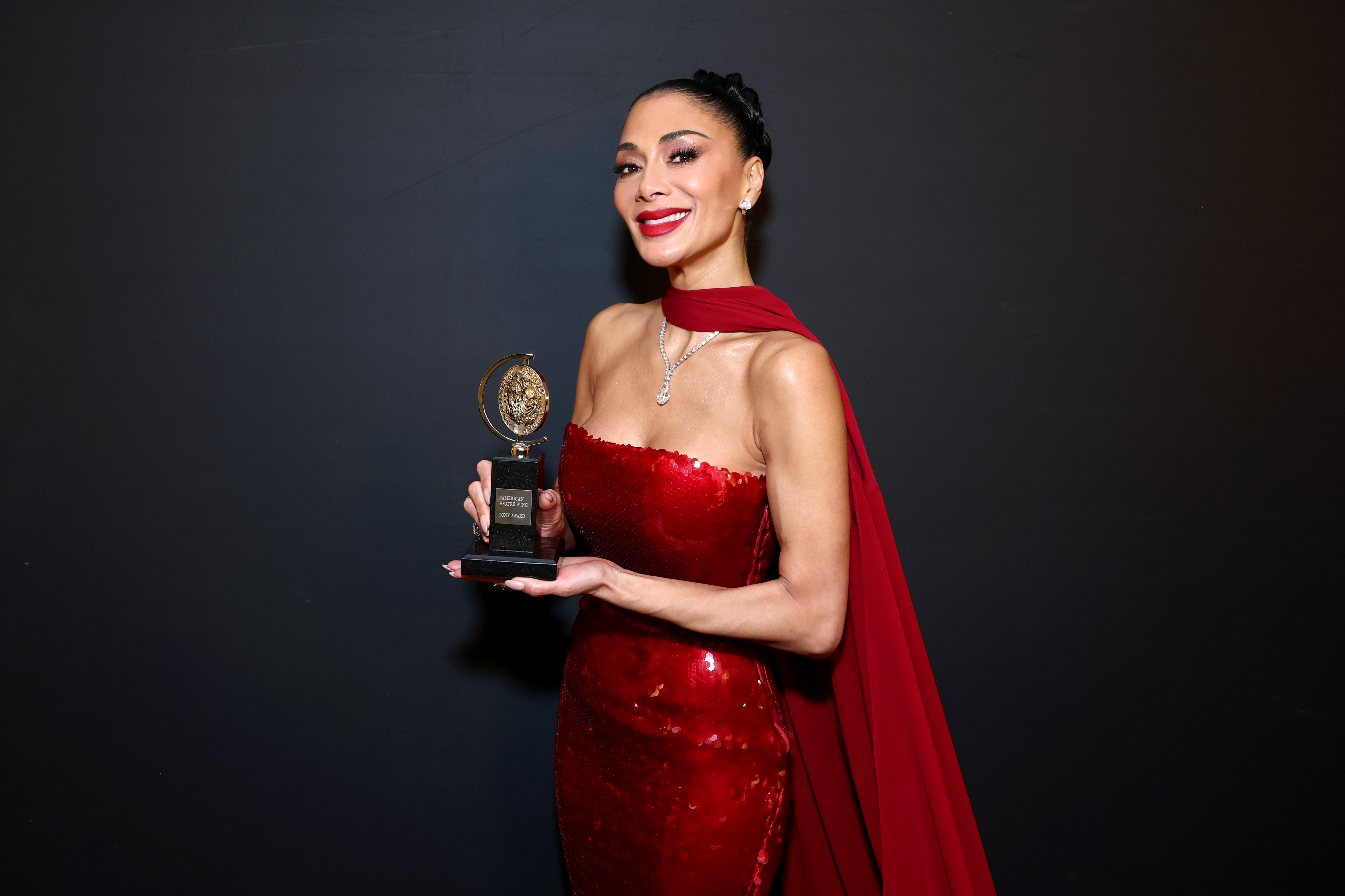 Nicole Scherzinger poses with the Best Performance by an Actress in a Leading Role in a Musical award for "Sunset Blvd" in The 78th Annual Tony Awards Media Room presented by Carnegie Mellon University at 3 West Club on June 8, 2025, in New York City. | Source: Getty Images