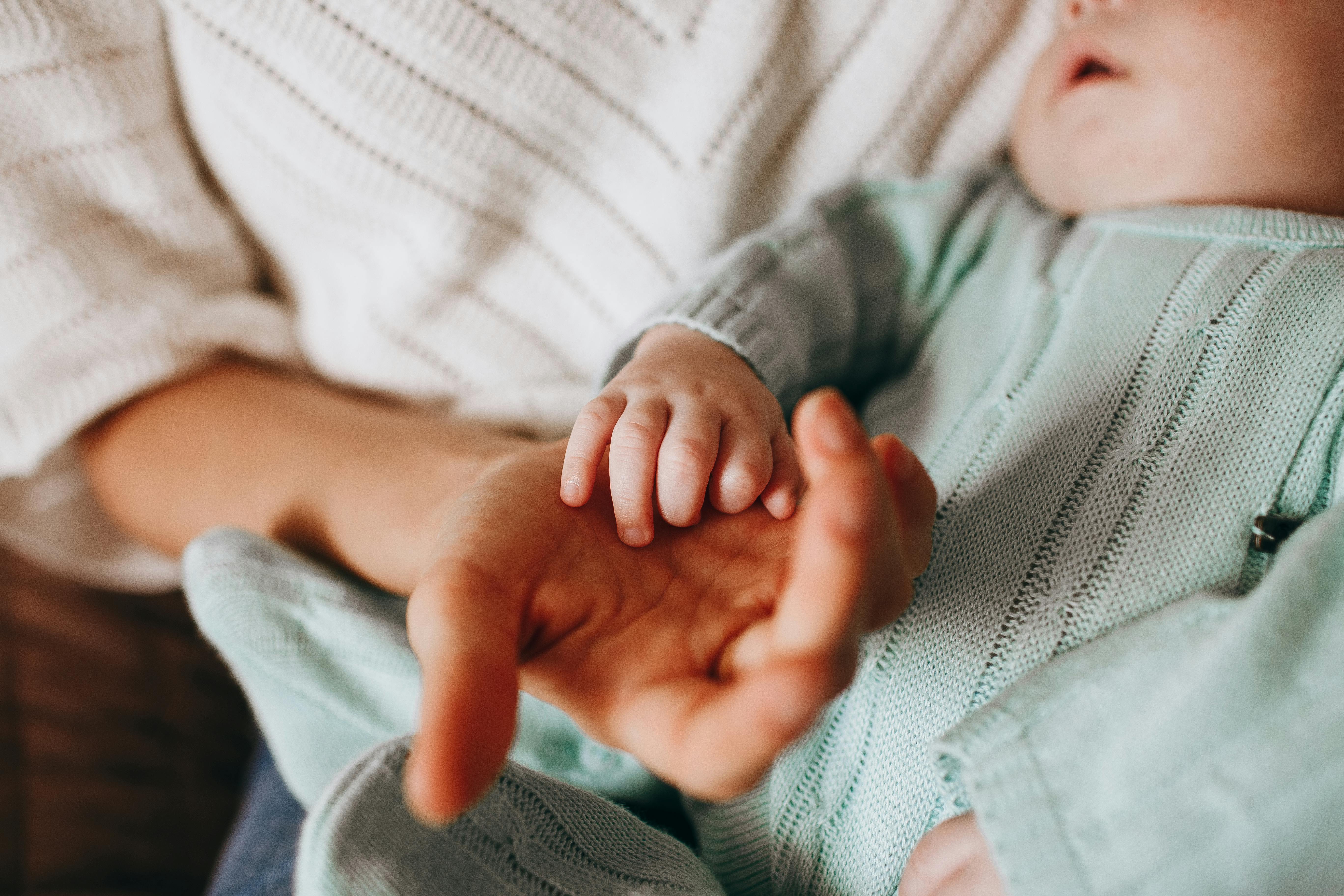 A person holding a baby boy | Source: Pexels