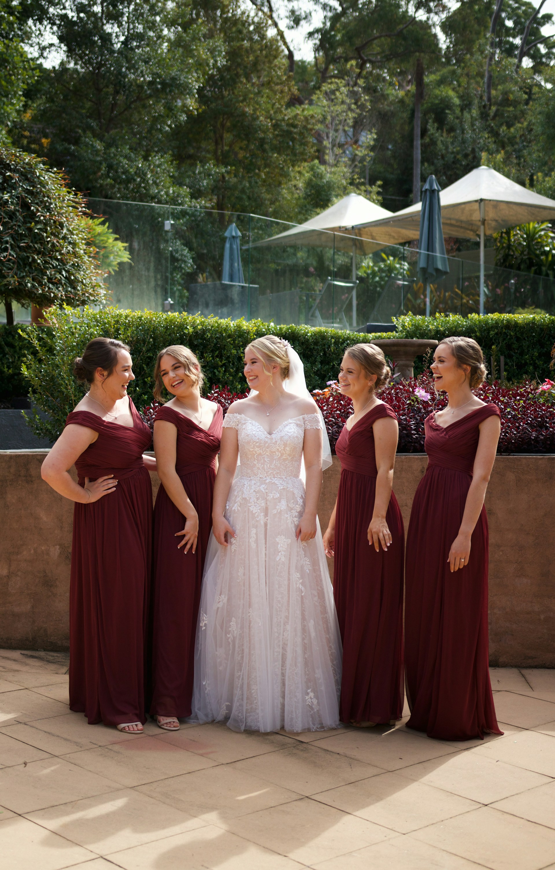 My Sister Made Me Eat in the Garage at Her Wedding Because 'There Wasn't Enough Space for Everyone Inside' 11 A bride standing with the bridesmaids | Source: Unsplash
