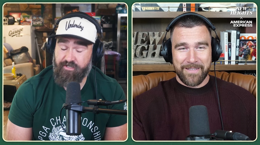 Jason and Travis Kelce react during a conversation about Travis' recent London trip with Taylor Swift on the "New Heights" podcast. | Source: YouTube/ New Heights