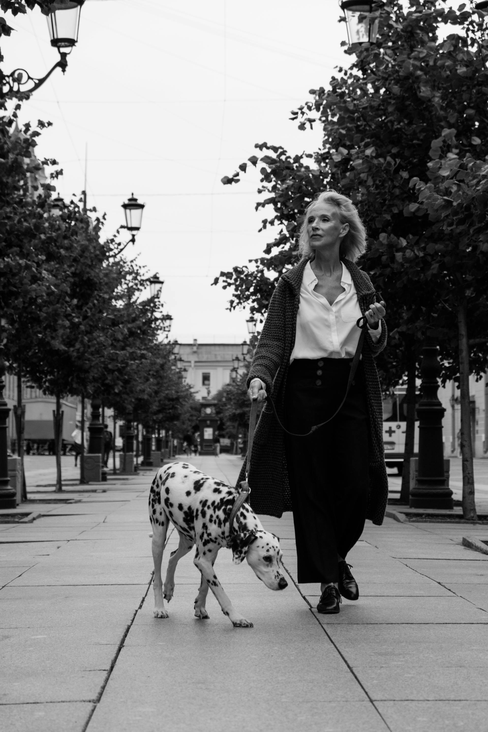 A woman walking a dog | Source: Pexels